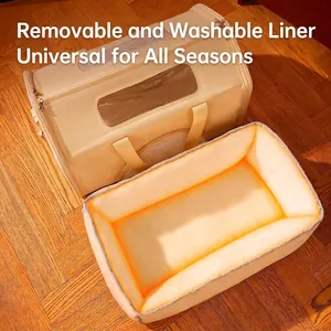 Winter pet carrier with removable plush liner and mesh windows on wooden floor