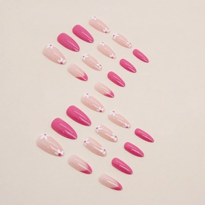 Almond shaped press-on nails with pink french tips and white floral designs set