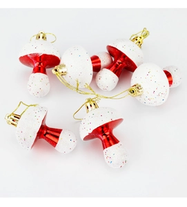 Set of six red and white mushroom Christmas ornaments with glitter and gold hanging strings