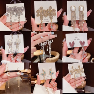 Detail of nine fashion earrings with S925 silver needles and sparkling rhinestones