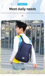 Detail of dark blue lightweight foldable backpack with breathable mesh straps and logo
