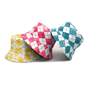 Three checkerboard bucket hats in yellow, magenta, and cyan shown on a white background