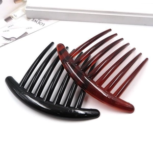 Detail view of seven-tooth hair combs in sleek black and tortoiseshell resin finishes
