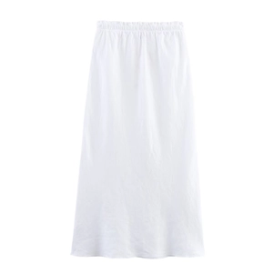 Detailed view of elastic waistband on white A-line midi skirt with clean texture