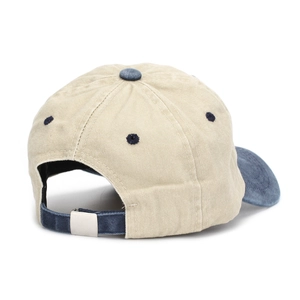 Detail of adjustable metal buckle and contrast strap on washed cotton baseball cap