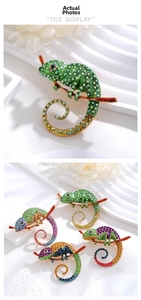 Detail of colorful crystal chameleon brooches on enamel branches with varied finishes