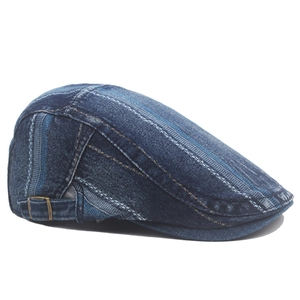 Detail of blue striped denim ivy cap featuring a vintage metal buckle for size adjustment