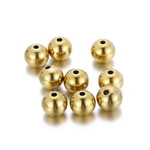 Close-up of polished 18K gold-plated stainless steel round beads for DIY jewelry