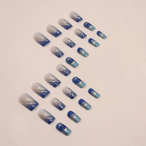 Medium-long square press-on nails with blue marble gradient and golden foil accents