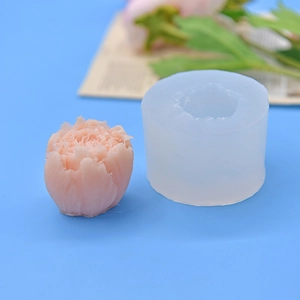 3D flower ball silicone mold for DIY cake baking and candle making on blue background