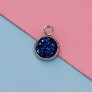 Close-up of 12mm silver stainless steel pendant with sparkling dark blue resin druzy stone