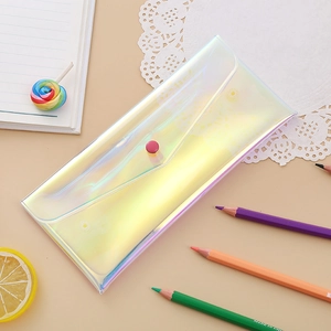 Detail showing the snap-button closure of a holographic laser transparent pencil pouch