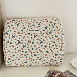 Quilted corduroy floral makeup bag with floral print and top zipper closure