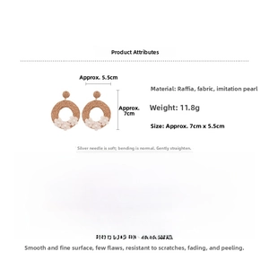 Detail view showing dimensions and materials of bohemian raffia floral pearl earrings