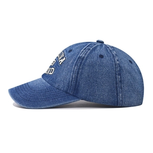 Vintage blue washed denim baseball cap with 1983 embroidery in a 45-degree side view