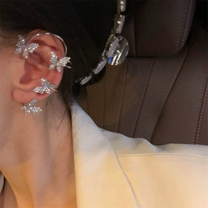 Silver butterfly ear cuff with sparkling rhinestones for non-pierced ears shown on ear