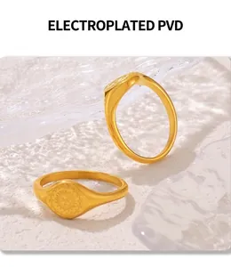 Detail of PVD electroplated 18K gold sunflower rings on ice texture background