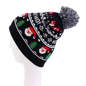 Detail of Christmas knit beanie with HO HO HO slogan and festive jacquard pattern