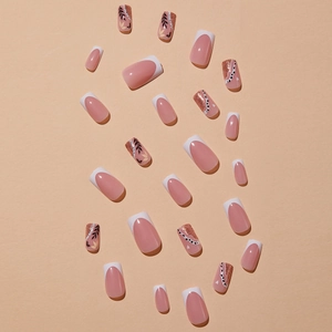 French tip press-on nails with leaf patterns and champagne glitter in a square shape