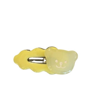 Cute yellow bear wave hair clip for women featuring cream color aesthetic and smooth resin finish