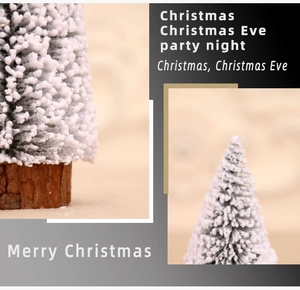 Detailed view of mini snow-flocked Christmas tree with rustic wooden base and bokeh background