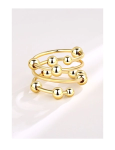 Detail of creative double-layer anxiety ring with movable gold beads for stress relief