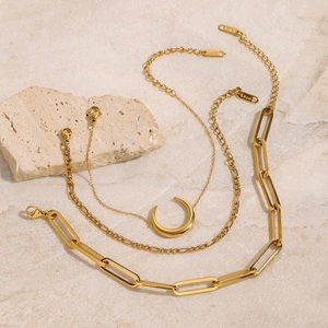 Minimalist 18K gold plated stainless steel bracelet set with moon pendant on marble base