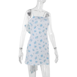 Detail view of floral print mini dress with bow straps on a mannequin