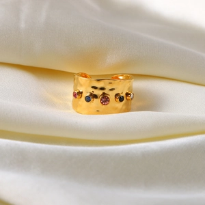 Detailed close-up of 18K gold plated hammered ring with multi-color zircon stones