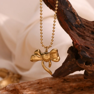 18K gold plated stainless steel necklace featuring 3D bow and heart pendants on bead chain