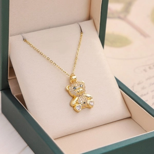Elegant gold teddy bear pendant necklace with sparkling rhinestones in a luxury gift box