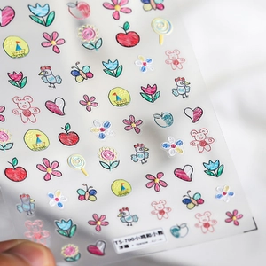 Macro shot of 3D embossed nail art stickers featuring cute chick and bear designs