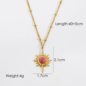 Detail view of a 14k gold sunburst necklace with a pink stone and 40+5cm chain length