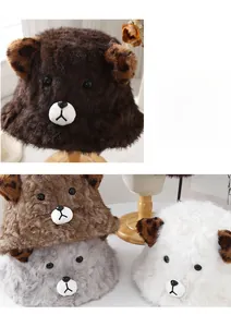 Detail of plush winter bucket hat with cute bear ears and leopard print inner fabric
