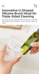 Detail showing a yellow U-shaped silicone brush head cleaning the edge of a glass cup