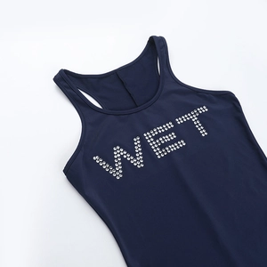 Detail shot of the rhinestone WET lettering on a navy blue sleeveless bodysuit