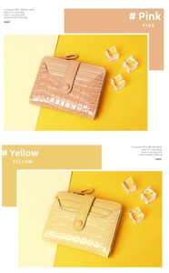 Detail of compact mini crocodile pattern wallets in pink and yellow with zip pockets