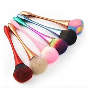 Detailed row of six large mushroom head makeup brushes with colorful metal handles