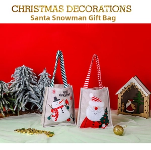 Detail of Christmas Santa and Snowman gift bags with striped handles and linen texture