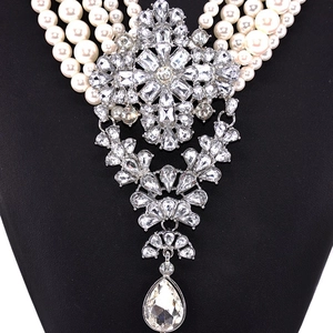 Luxurious multi-layer pearl necklace with a large crystal cross and teardrop pendant