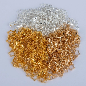 Macro view of 5mm hollow star metal jewelry links in gold and silver finishes