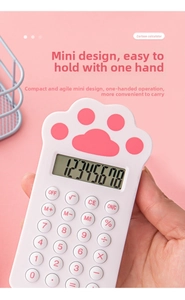 Close-up of cute cat paw calculator with pink pad detail held in hand