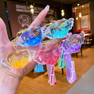 Portachiavi cuore con ali luminose e sabbie mobili liquide in cinque colori