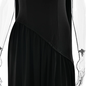 Detail showing the pleated patchwork and asymmetrical waist seam of this black maxi dress