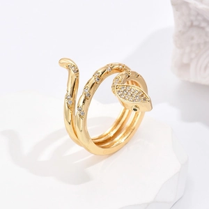 18K gold plated snake-shaped ring with sparkling cubic zirconia on a stone base