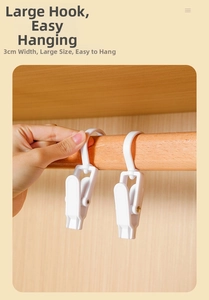 Detail of multi-purpose white plastic hook clip with 3cm opening and strong spring