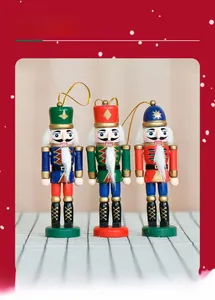 Close-up of three handcrafted 13cm wooden nutcracker ornaments for Christmas tree decor