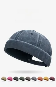 Detail showing multiple color variants of washed cotton docker hats with vintage texture