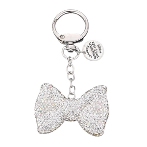 Silver rhinestone bow keychain with sparkling crystals and metal ring on white background