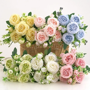 Detail of five bundles of artificial peony flowers in yellow, pink, blue, green and white